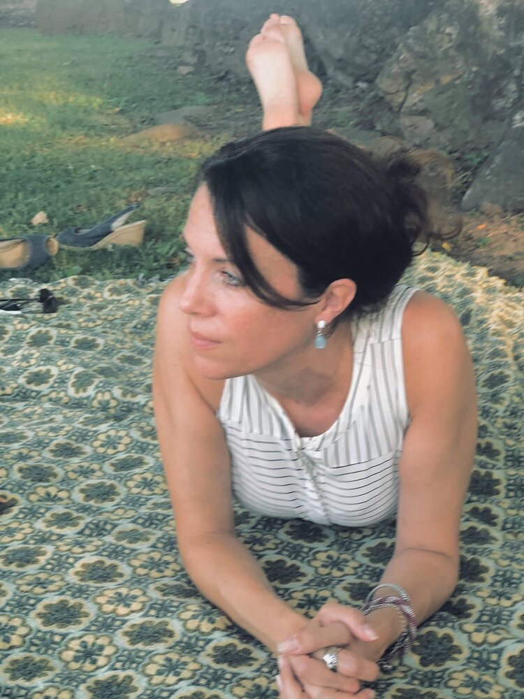 Mandy relaxing outdoors on a blanket